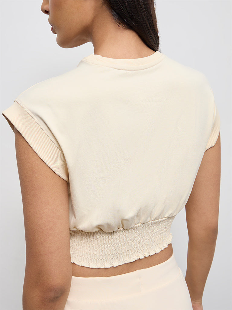 Nuoflexx Cream Text Printed Cotton-Blend Smocked Top
