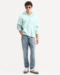 Rare Rabbit Men's Rokk Light Blue Cotton Blend Fabric Shank And Zipper Kurt Carrot Plain Jeans